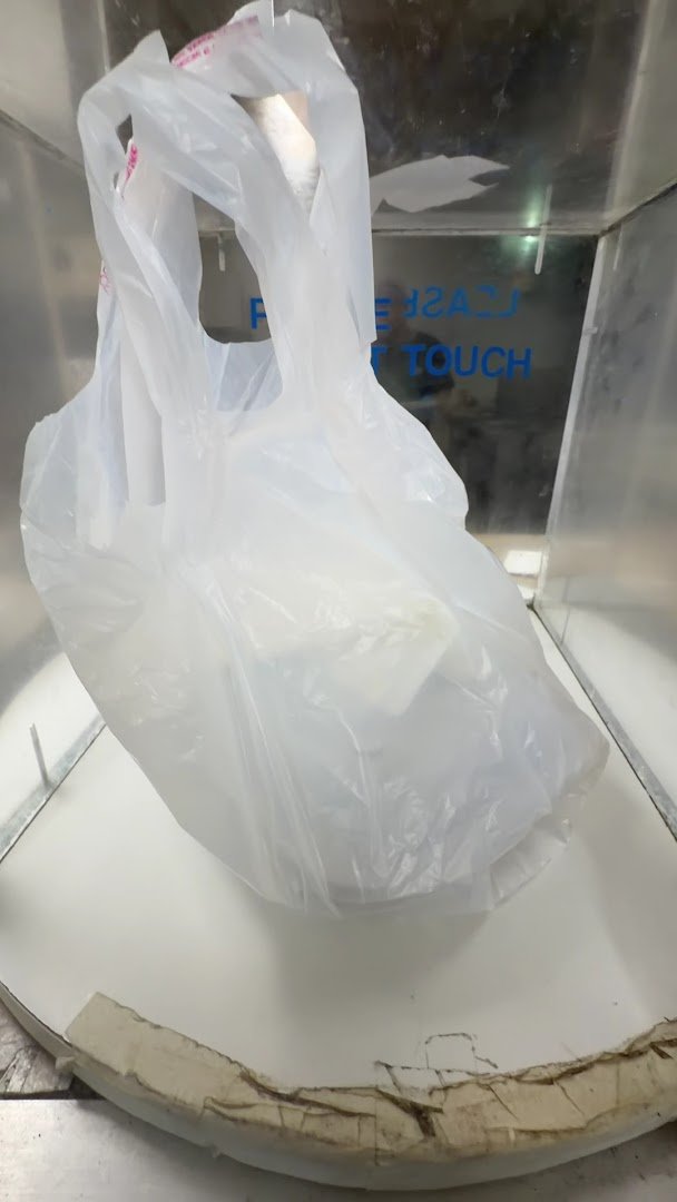 Takeaway bags lined up near the service counter.