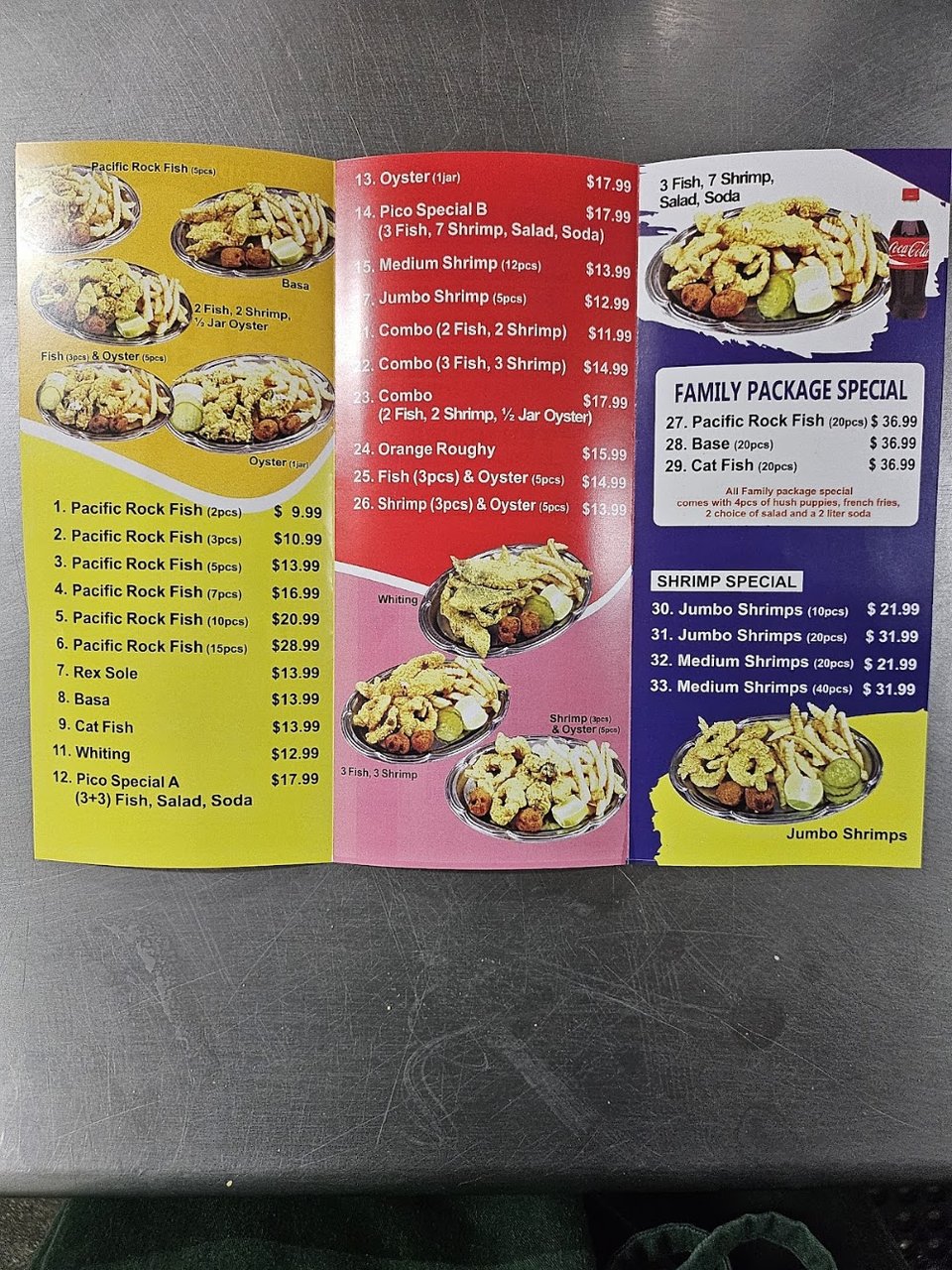 Menu board listing seafood, sides, and drinks.