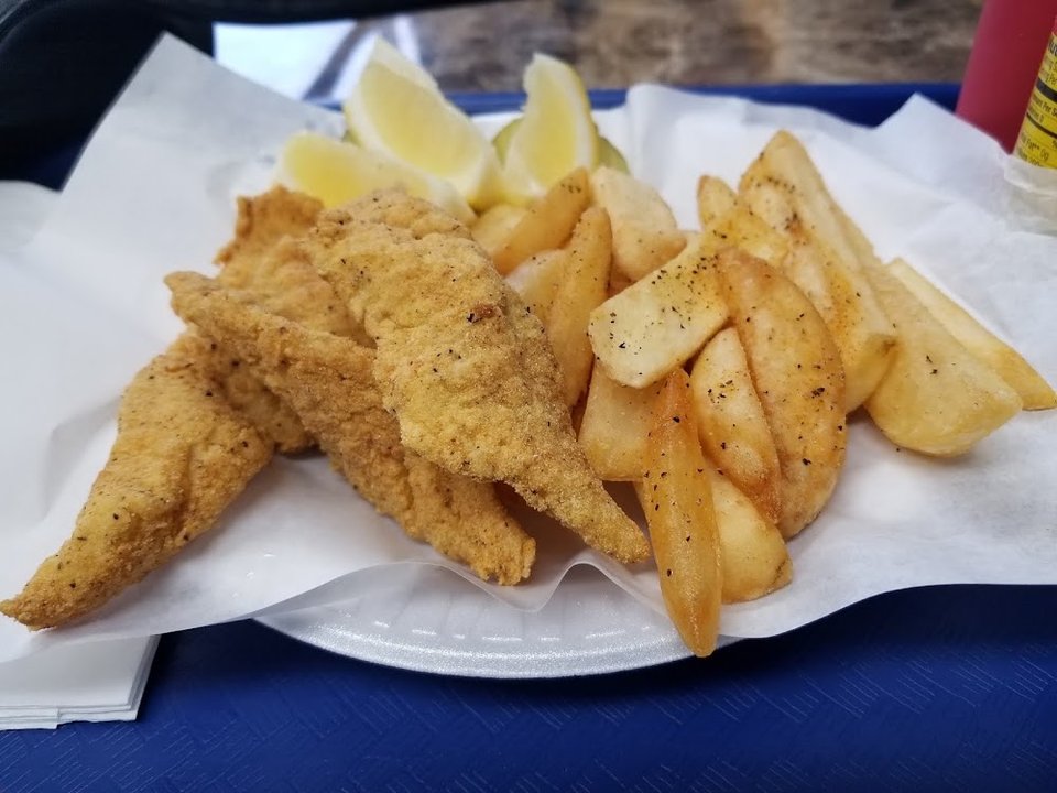 Printed menu with shrimp specials and family combos.