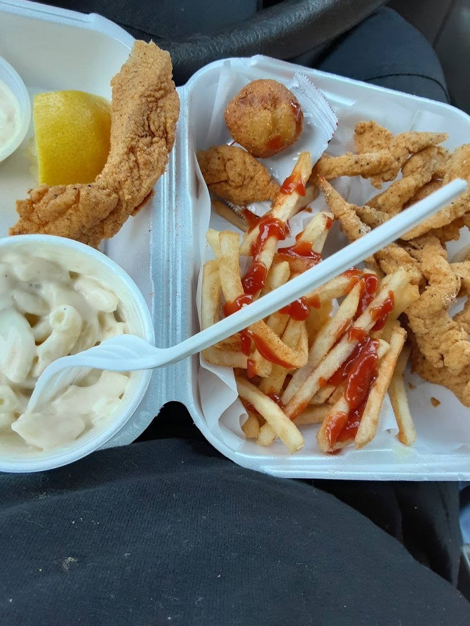 Restaurant menu showing fish plates and soda options.